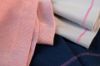 Close-up of Bernina Blind Stitch Foot #C19 creating an invisible hem on fabric on a Bernina L 890 overlocker.