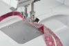 Bernina Piping Foot #L16S in use, sewing piping onto a lightweight fabric sample.